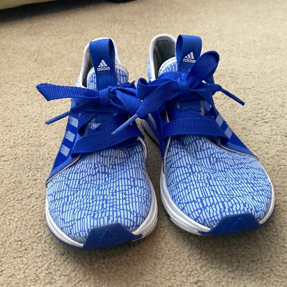 Bright blue Addidas tennis shoes